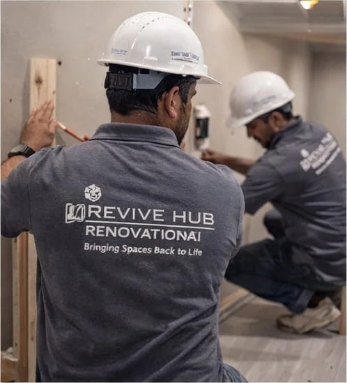 Revive Hub renovation crew finishing a complete Dubai basement conversion project — final electrical, ceiling, and floor finishes for a fully approved basement habitable space