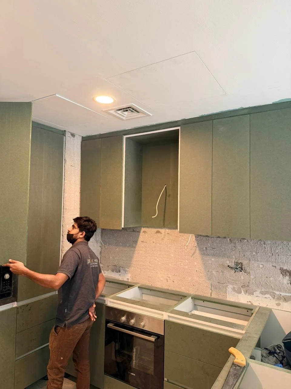 Raz Al JVC villa kitchen before structural change with Revive Hub team working on site